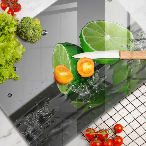 Tabla de cortar de vidrio Limas jugosas y agua