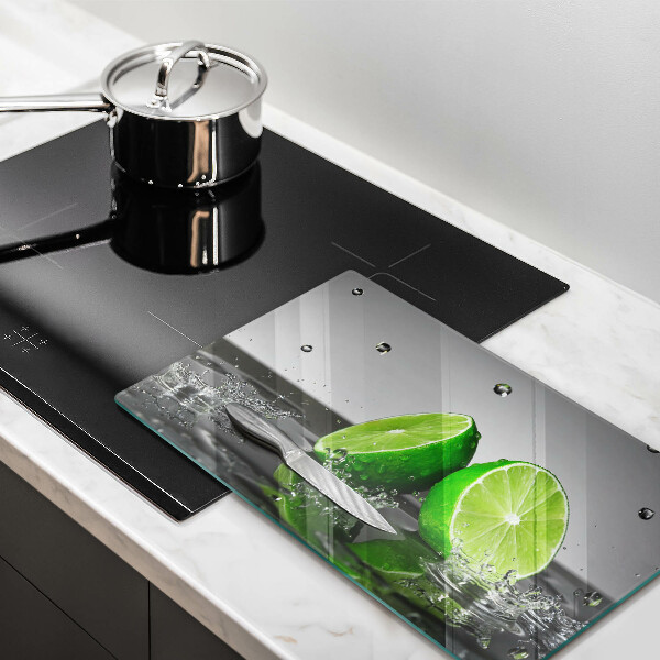 Tabla de cortar de vidrio Limas jugosas y agua