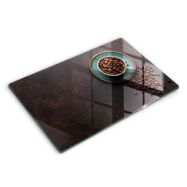 Tabla de cortar de vidrio Una taza de granos de café