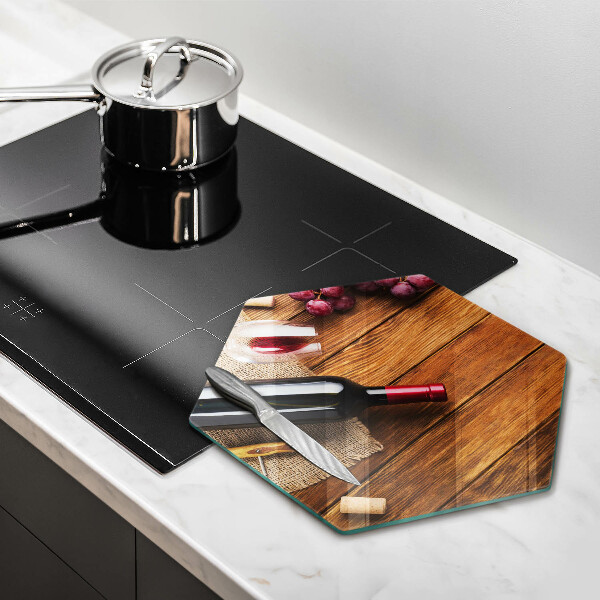 Tabla de cortar de vidrio Una botella de vino tinto