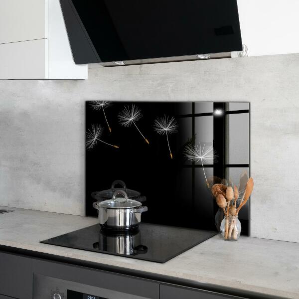 Paneles de vidrio para la cocina Dientes de león en el viento