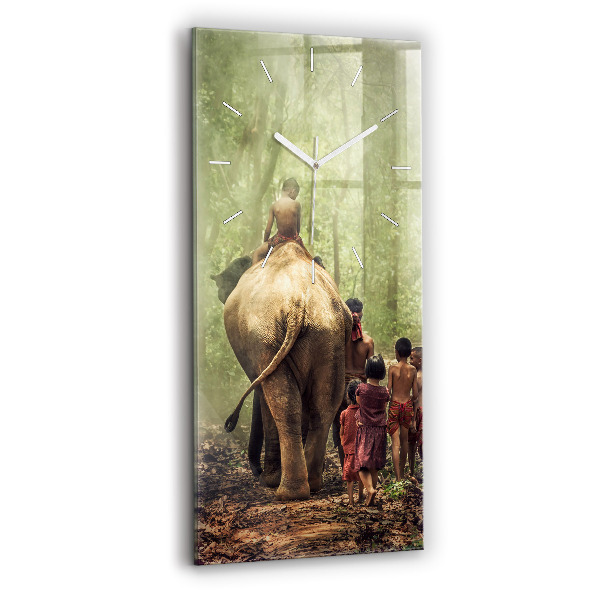Reloj de vidrio vertical Niños guiando a un elefante - espejomat.es
