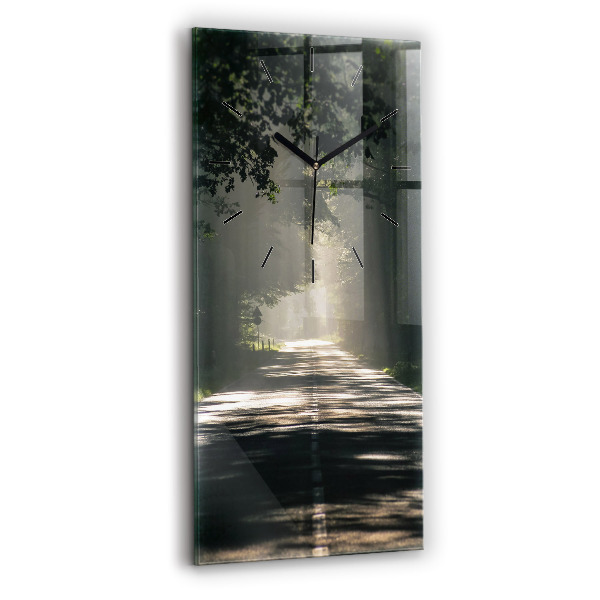 Reloj de vidrio vertical Carretera forestal y rayas de sol - espejomat.es