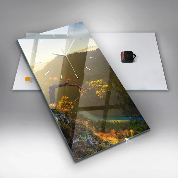 Reloj vertical Puesta de sol sobre montañas - espejomat.es