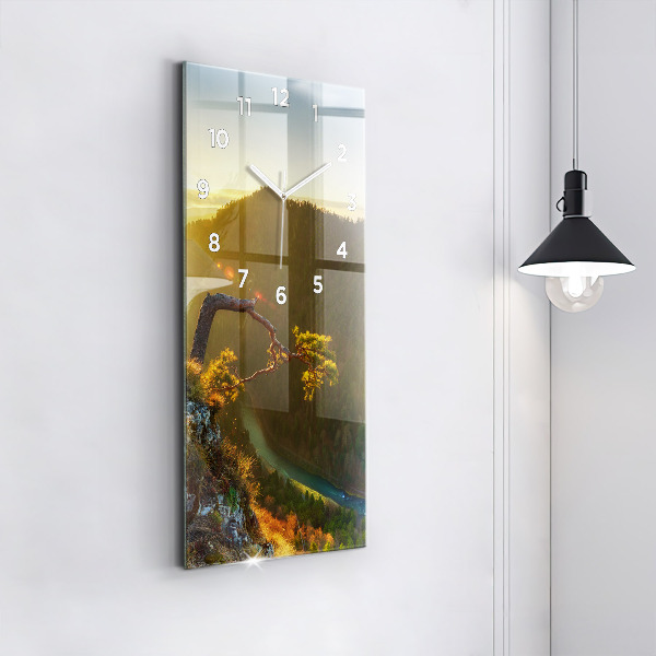 Reloj vertical Puesta de sol sobre montañas - espejomat.es