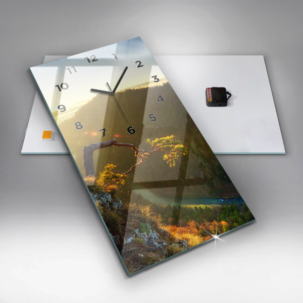 Reloj vertical Puesta de sol sobre montañas - espejomat.es