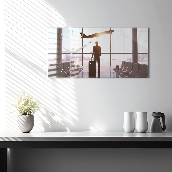 Reloj horizontal Hombre en el aeropuerto