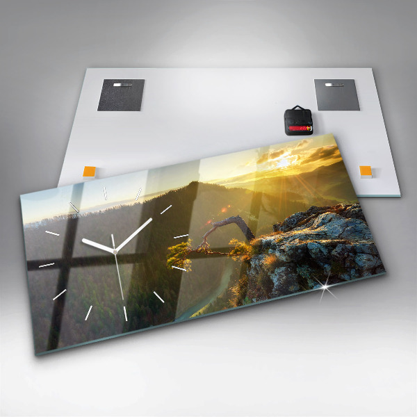 Reloj horizontal Puesta de sol sobre las montañas