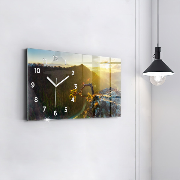 Reloj horizontal Puesta de sol sobre las montañas