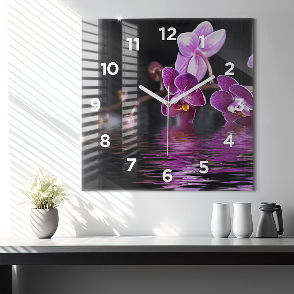 Reloj cuadrado Flor de orquídea sobre el agua