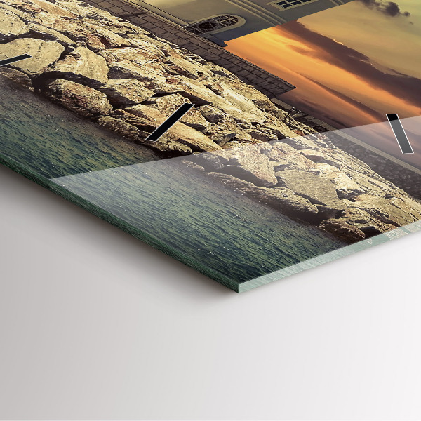 Reloj cuadrado Faro en el mar