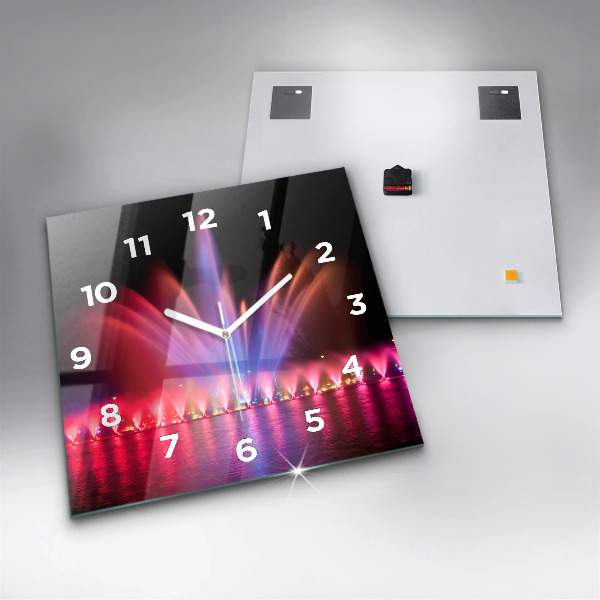 Reloj cuadrado Fuente de Wrocław por la noche