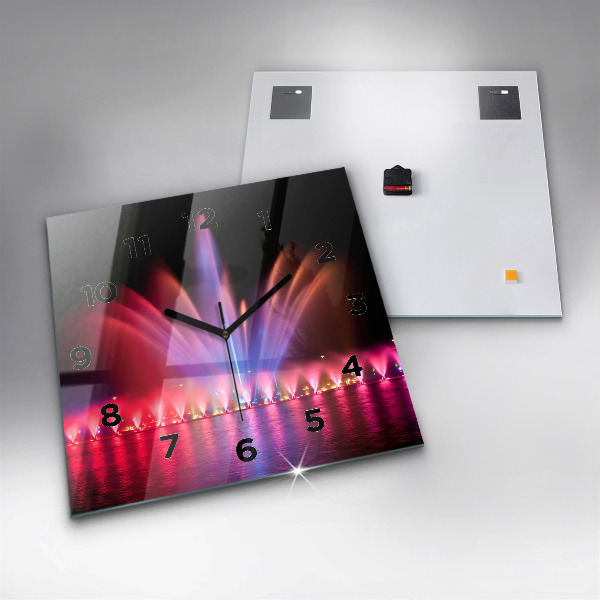 Reloj cuadrado Fuente de Wrocław por la noche