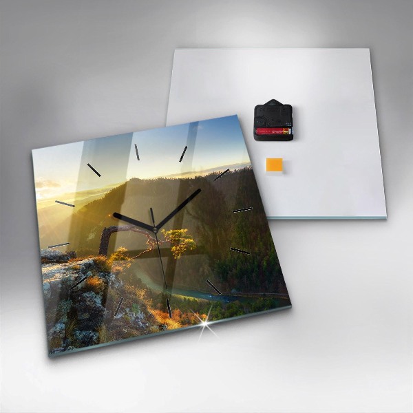 Reloj cuadrado Puesta de sol sobre montañas