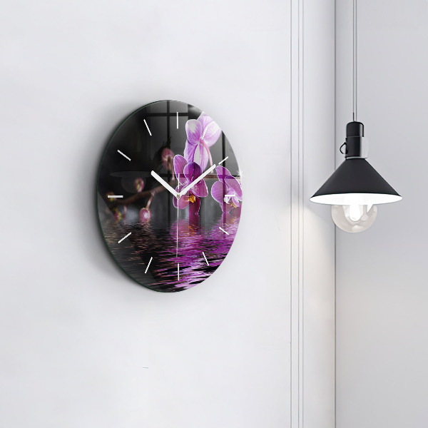 Reloj de cristal redondo Flor de orquídea sobre el agua