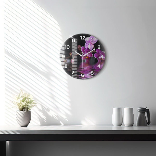 Reloj de cristal redondo Flor de orquídea sobre el agua