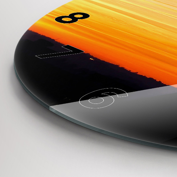 Reloj de cristal redondo Edificio y puesta de sol